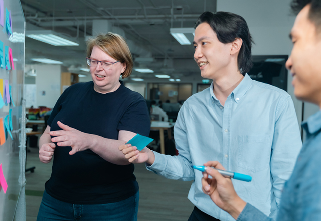 Three people in a workshop