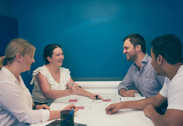 Four people in a workshop